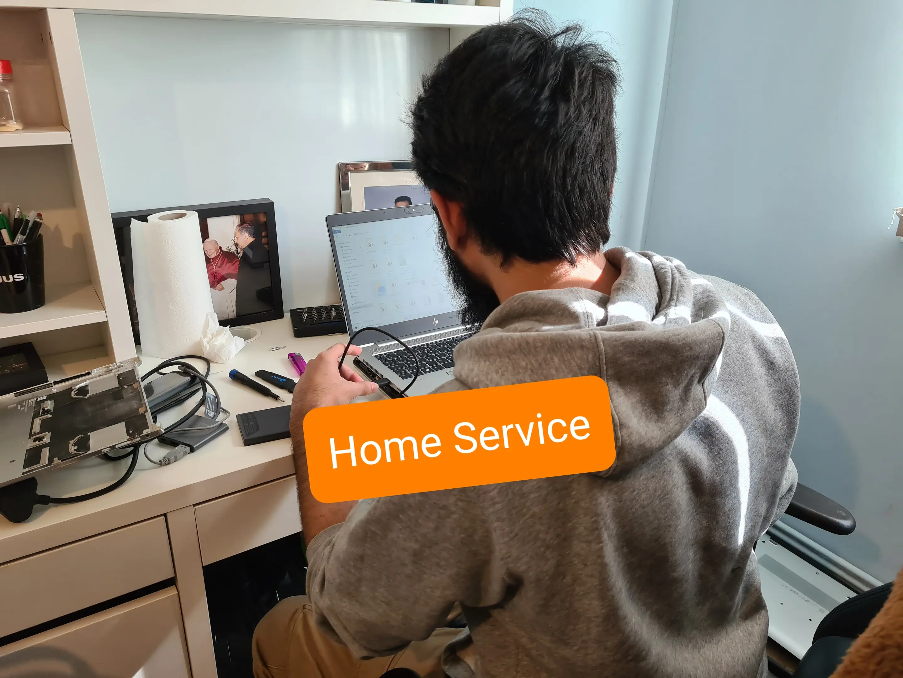 Our PC specialist repairing the laptop at home visit